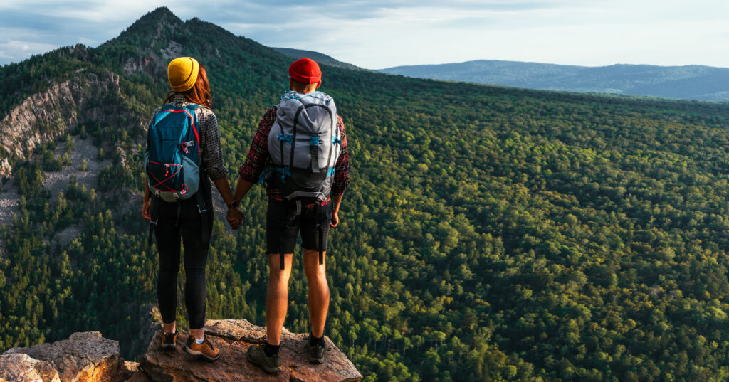 a traveling couple in the mountains